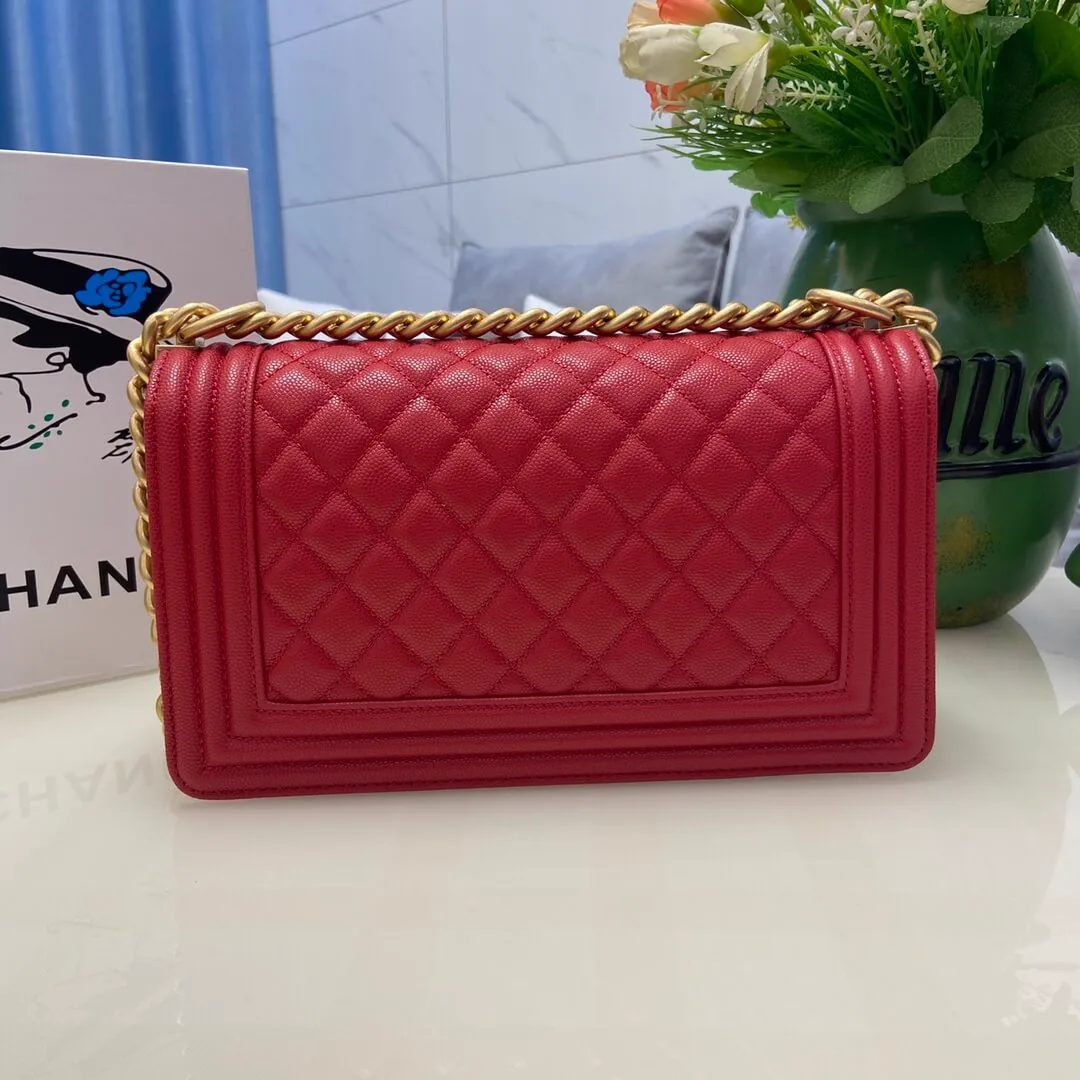 Reference image illustrating Replica Chanel Boy Bag in Red Calfskin and Gold-Tone Metal (A67086 Style)