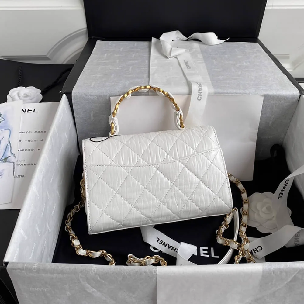 Reference image illustrating Replica CHANEL Mini Flap Bag with Top Handle – White Lambskin (Style AS2477)
