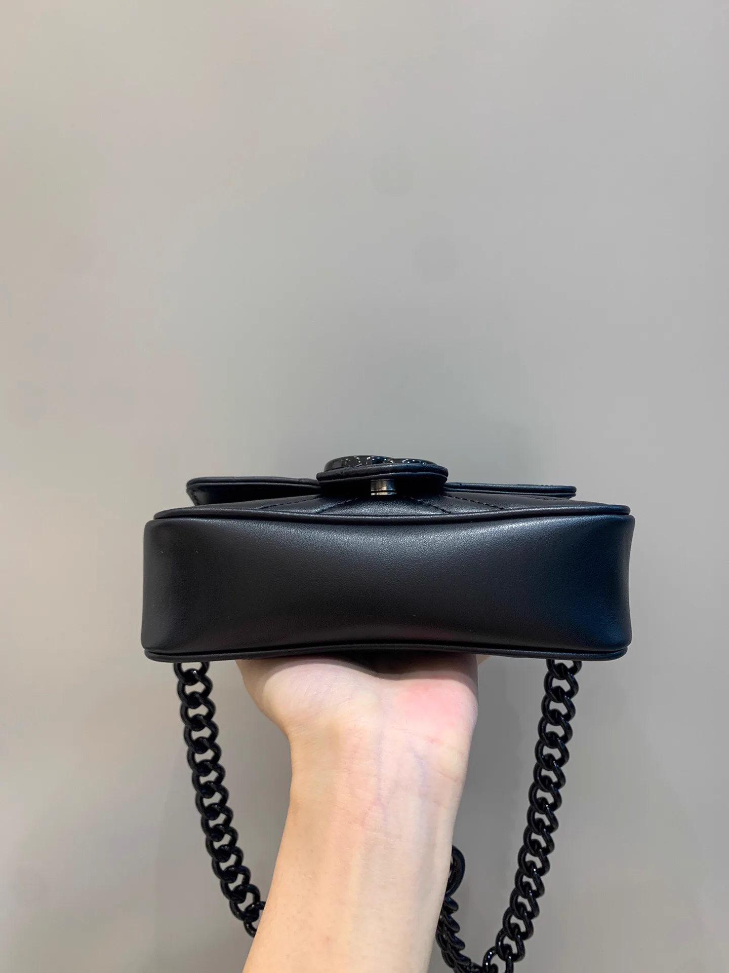 Reference image illustrating Replica Gucci Marmont Mini Shoulder Bag – Iconic GG Matelassé Design