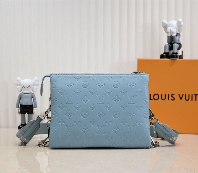 Reference image illustrating Replica Louis Vuitton Coussin PM Bag in Turquoise Blue with Jacquard Strap