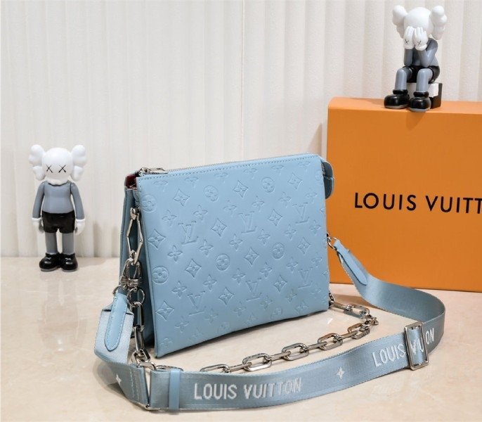 Reference image illustrating Replica Louis Vuitton Coussin PM Bag in Turquoise Blue with Jacquard Strap