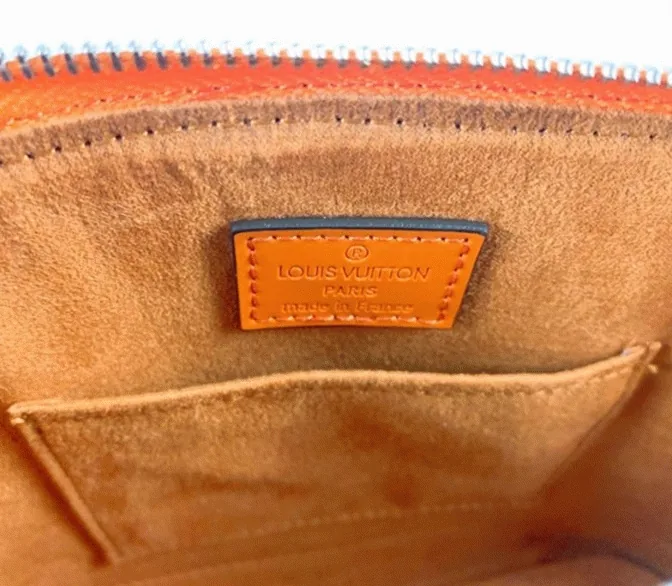 Reference image illustrating Replica Louis Vuitton Epi Leather Alma BB Handbag in Orange with Jacquard Strap