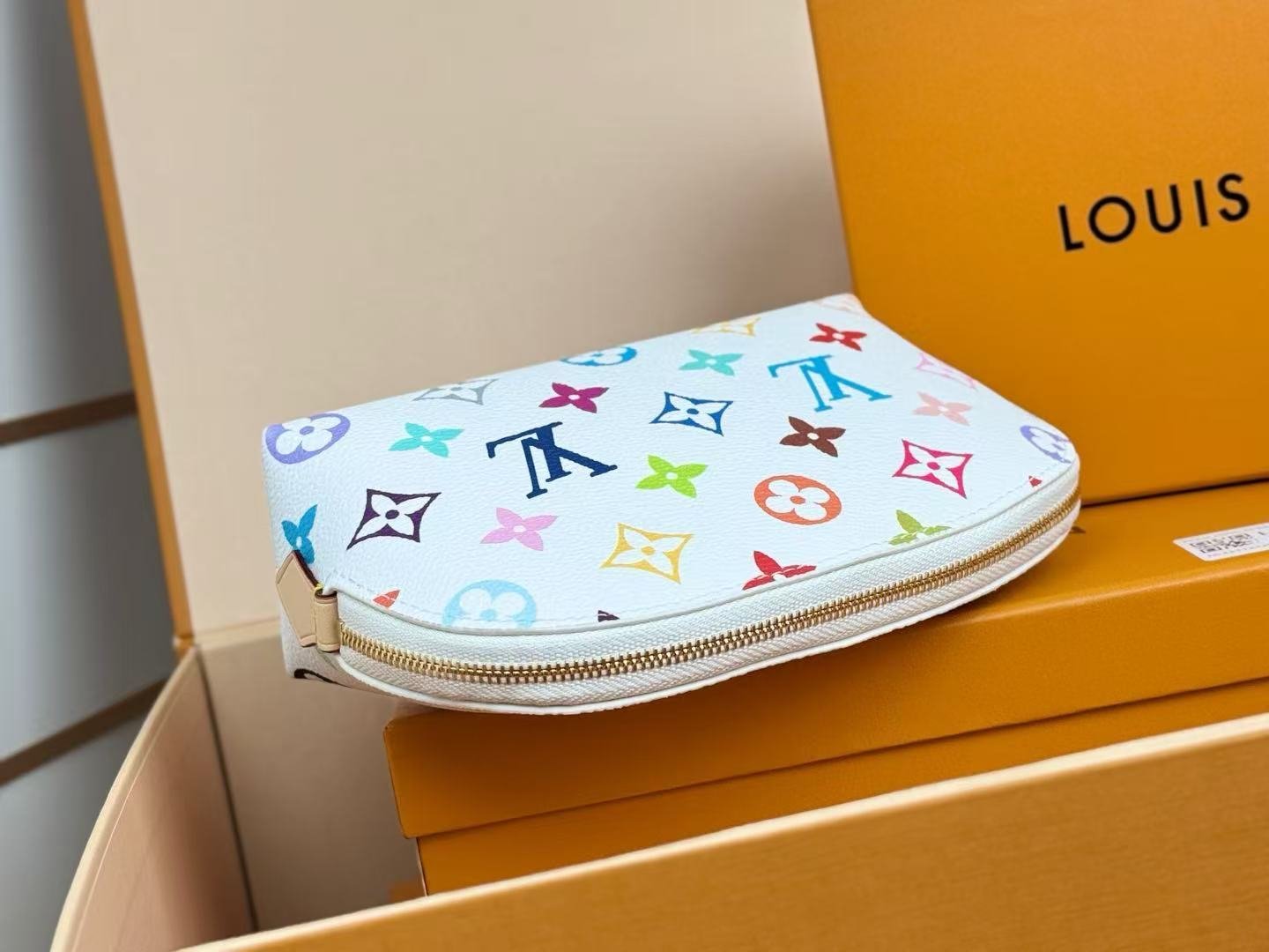 Reference image illustrating Replica Louis Vuitton x Takashi Murakami Pochette Cosmetique Cosmetic Bag