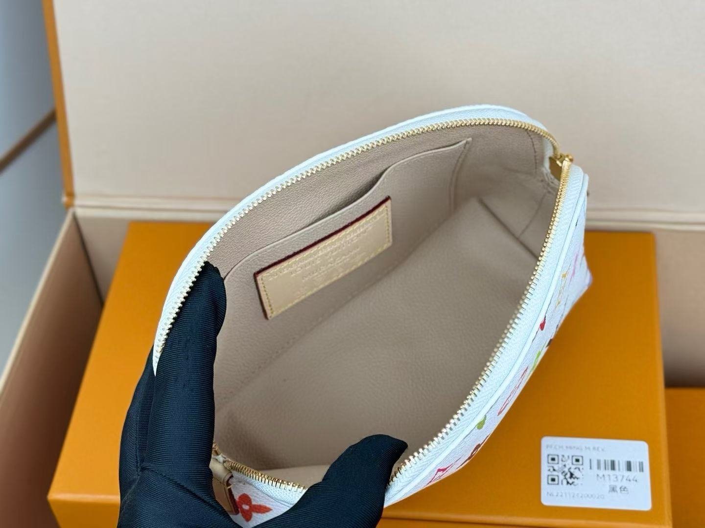Reference image illustrating Replica Louis Vuitton x Takashi Murakami Pochette Cosmetique Cosmetic Bag