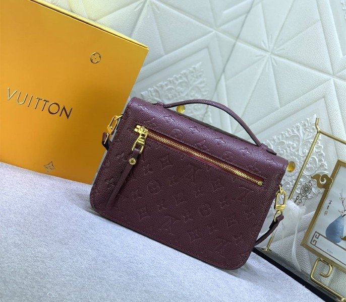 Reference image illustrating Replica LV Monogram Empreinte Leather Métis Hobo Bag in Wine