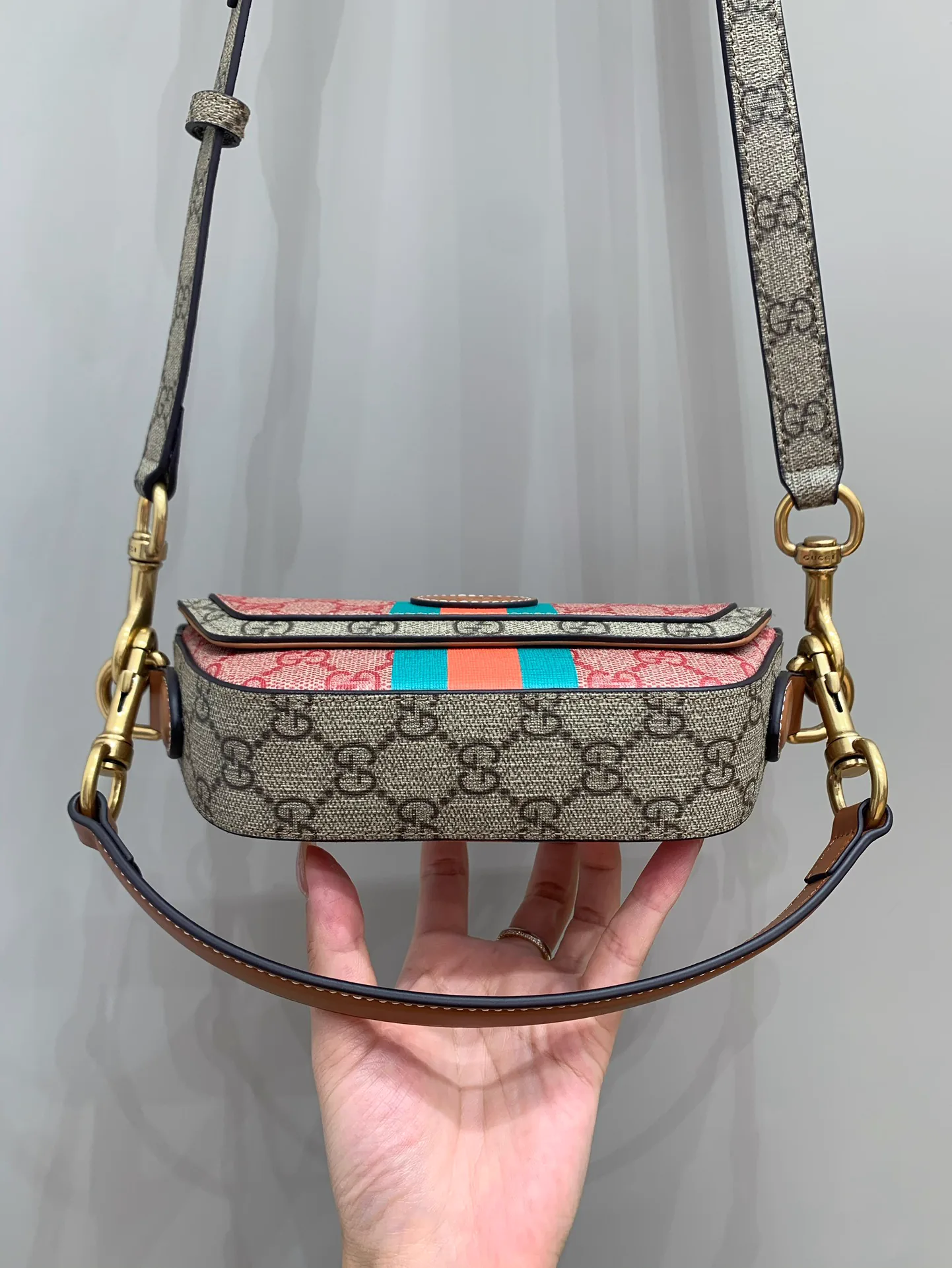 Reference image illustrating Replica Gucci Mini GG Supreme Top-Handle Bag – Iconic Canvas Design