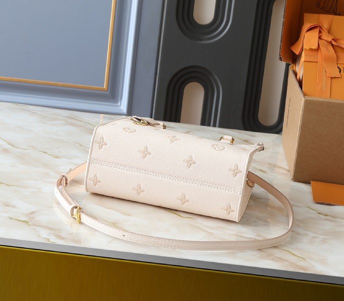 Reference image illustrating Replica Louis Vuitton OnTheGo PM Eden Handbag – Detailed Style Guide