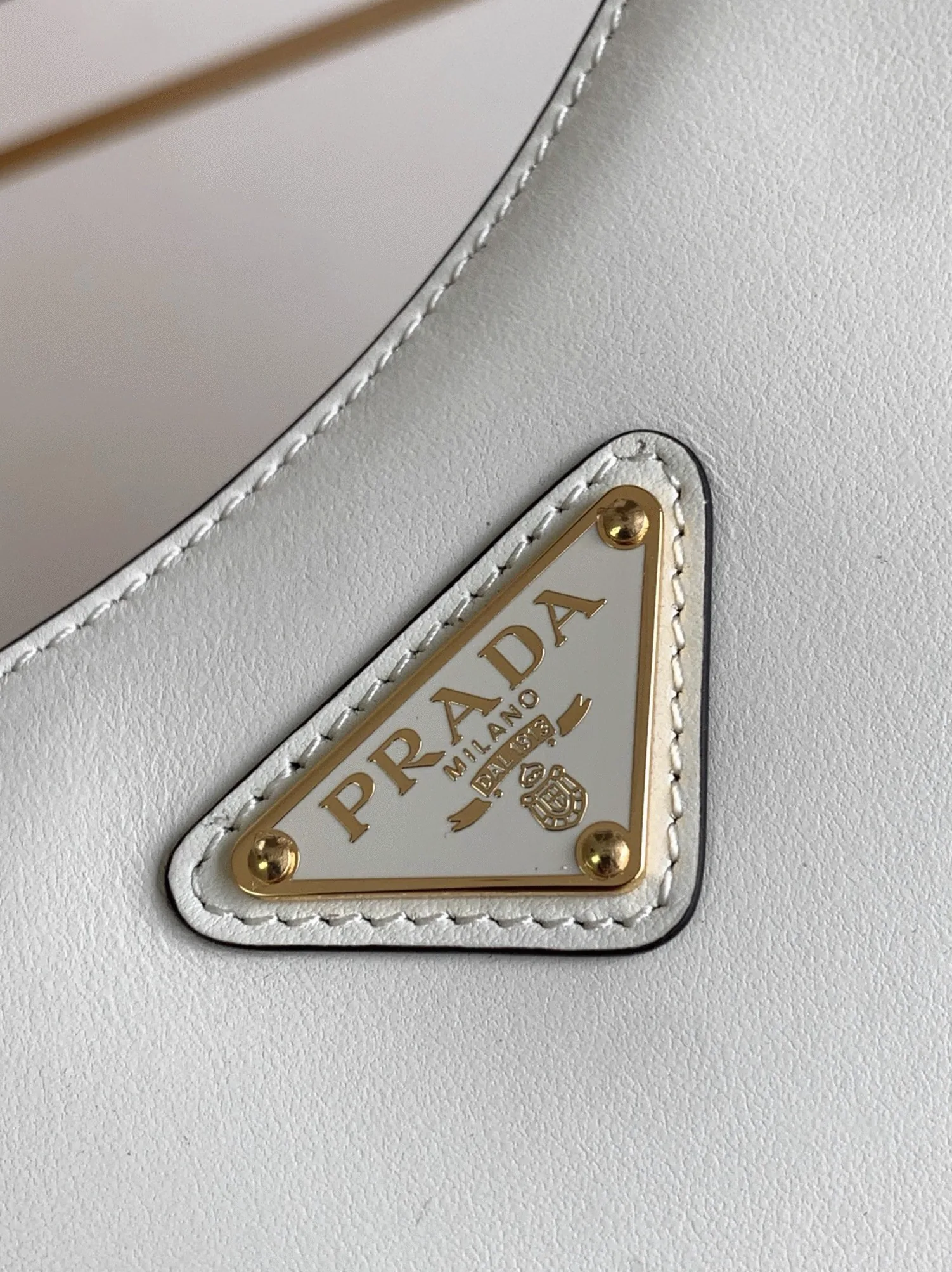 Reference image illustrating Replica Prada Arque Mini Shoulder Bag in White – Design, History & Styling Guide