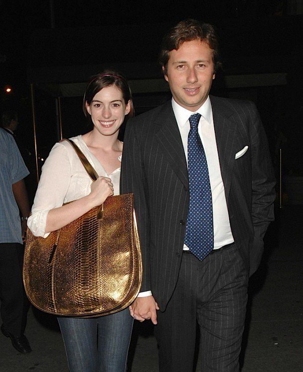 Reference image illustrating Anne Hathaway's Handbag Collection: From Chanel Classics to Red Carpet Clutches