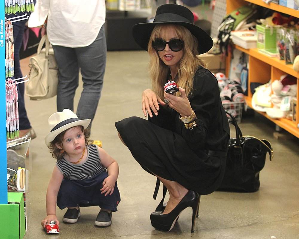Reference image illustrating Celebrity Mom Shoe Style: Designer Boots, Pumps & Sneakers Worn by Famous Mothers