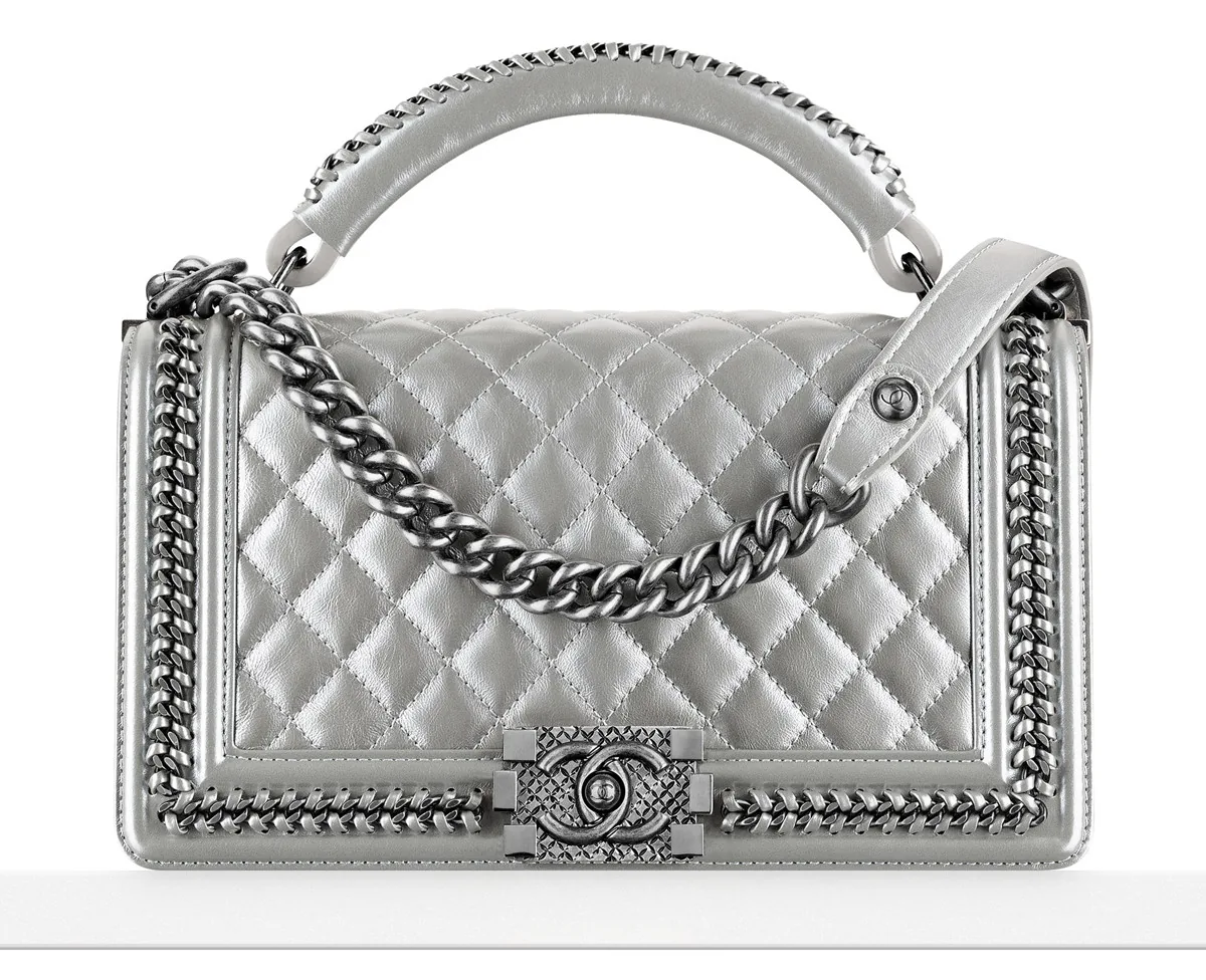 Reference image illustrating Chanel Boy Bag with Handle: A Detailed Look at the Top Handle Addition