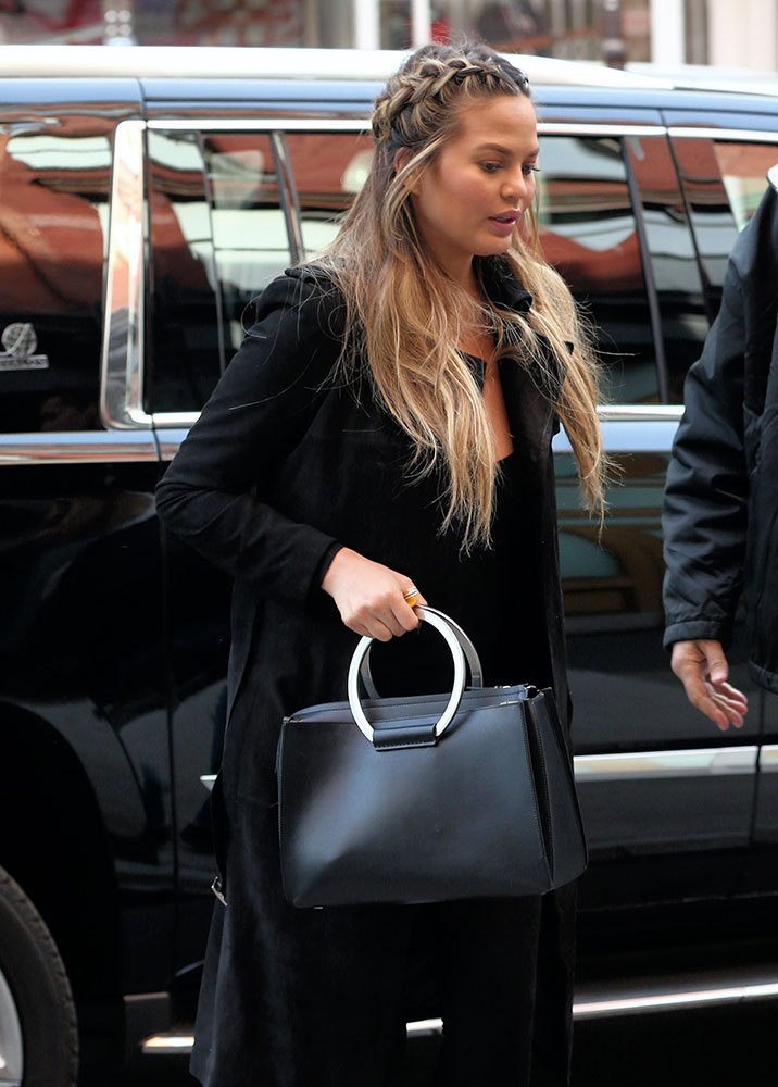 Reference image illustrating Chrissy Teigen’s Impressive The Row Handbag Collection: A Celebrity Style Breakdown