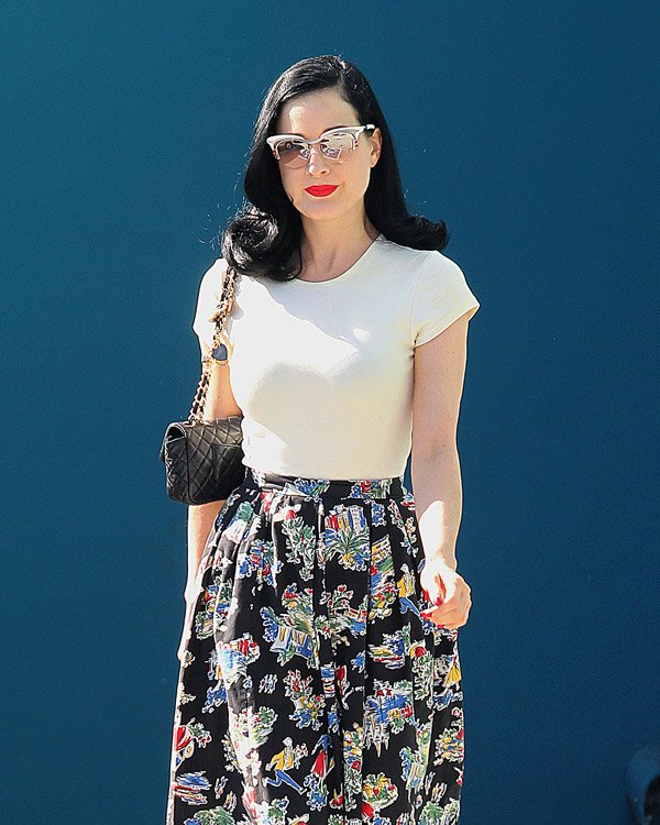 Reference image illustrating Dita Von Teese’s Post-Pilates Look: A Chanel Flap Bag and Impeccable Style