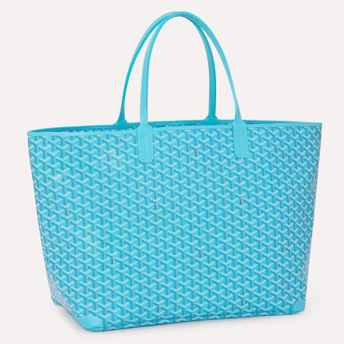 Reference image illustrating Goyard Into the Blue Collection: Caribbean Turquoise Artois, Belharra & Méditerranée Bags