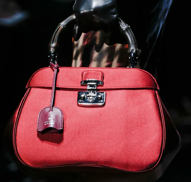 Reference image illustrating Gucci Fall 2013: Matte Black Bamboo Handles Get a Modern Makeover