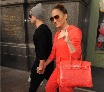 Jennifer Lopez’s Monochrome Look: Crocodile Hermès Birkin Meets Orange Tracksuit thumbnail