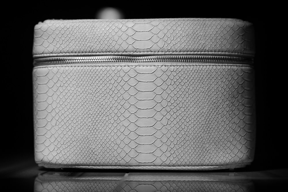 Reference image illustrating Kendra Scott Beauty Bags: Faux Python Train Cases and Cosmetic Organizers for Holiday Gifting