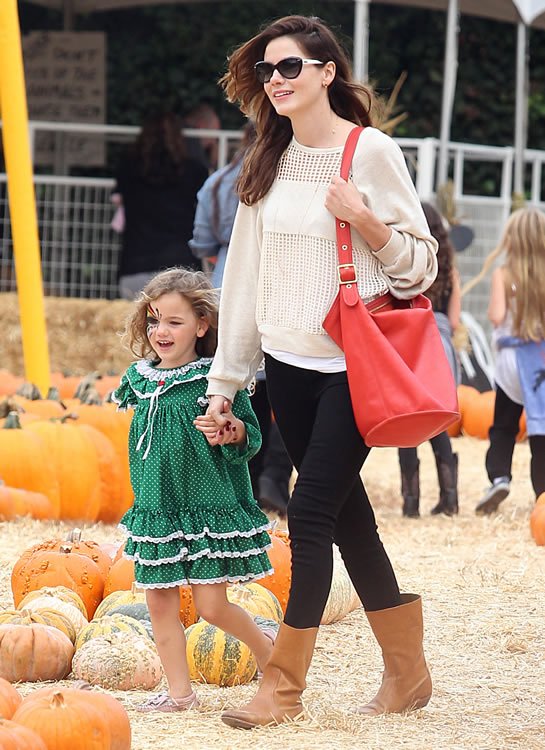 Reference image illustrating Michelle Monaghan’s Coach Legacy Duffle: A Classic Choice at Mr. Bones Pumpkin Patch