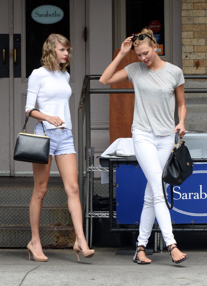 Reference image illustrating Taylor Swift and Karlie Kloss Coordinate in Black Dolce & Gabbana Agata and Sicily Bags