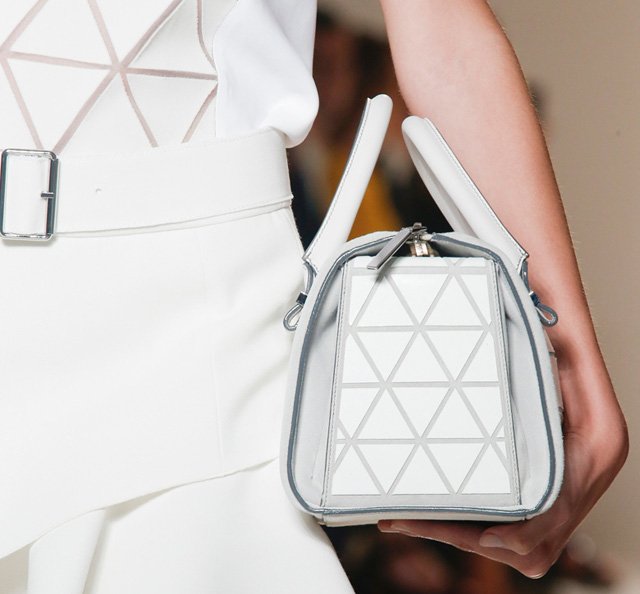 Reference image illustrating Victoria Beckham Spring 2014 Handbags: Petite Duffels and Triangular Prints
