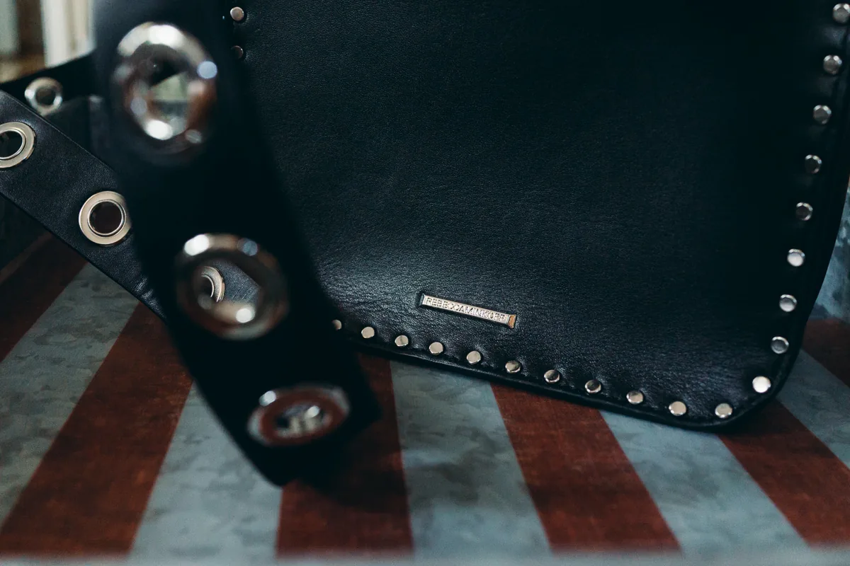 Reference image illustrating Rebecca Minkoff Midnighter Top Handle Bag Review: A Lightweight Studded Crossbody Under $300