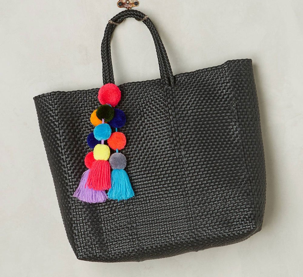Reference image illustrating Spring’s Most Coveted Handbag Trend: Pompoms and Tassels Take Over Luxury Bags