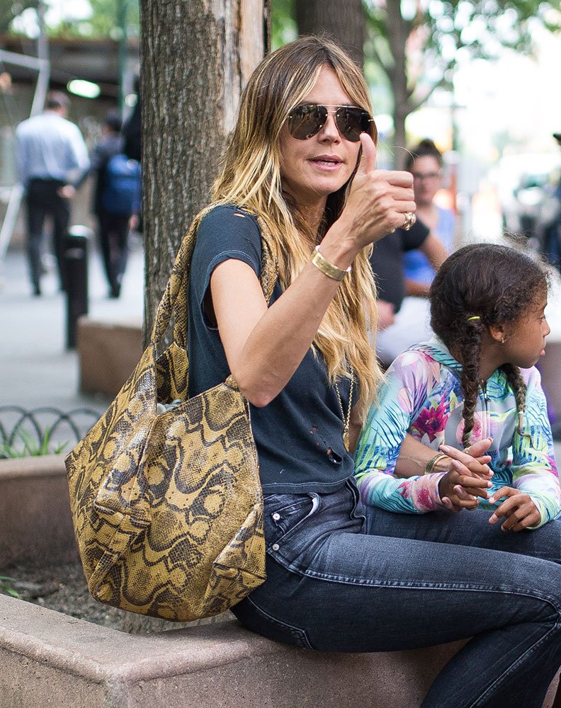 Reference image illustrating Summer Celebrity Handbag Style: Chanel Shearling, Givenchy Python, and Louis Vuitton City Steamer