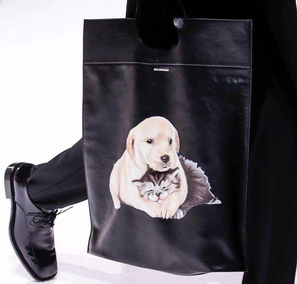 Reference image illustrating Balenciaga Fall 2018 Bags: Loud Logos, Puppy Prints, and a World Food Programme Partnership