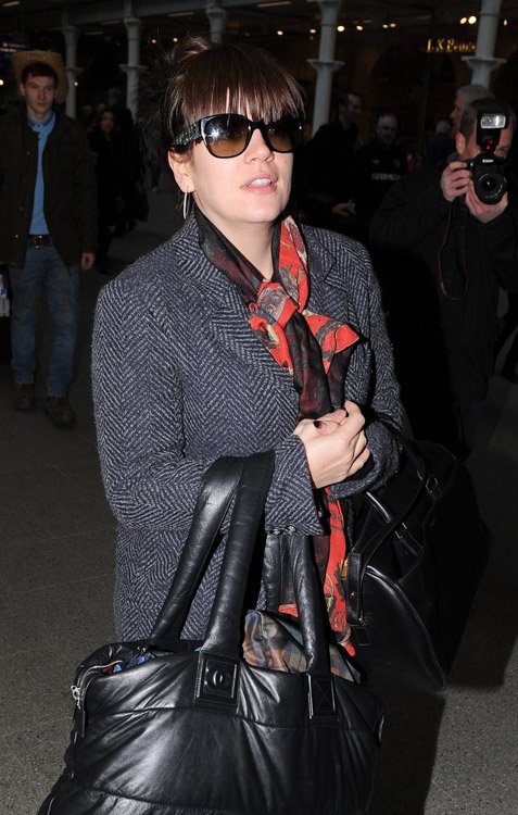 Reference image illustrating Lily Allen Doubles Up on Chanel Coco Cocoon and Saint Laurent Classic Duffel Bags at St. Pancras