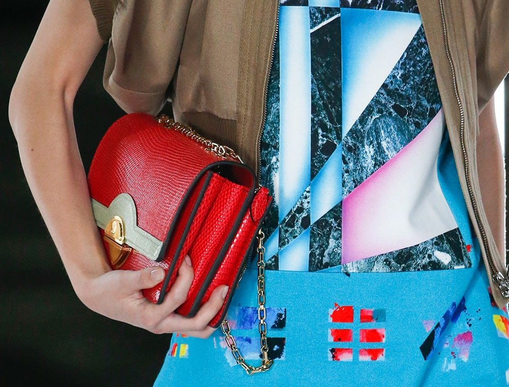 Reference image illustrating Louis Vuitton Spring 2019 Handbag Collection: Sculptural Shapes, Mini Suitcases, and Avant-Garde Design