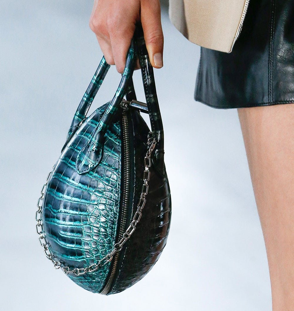 Reference image illustrating Louis Vuitton Spring 2019 Handbag Collection: Sculptural Shapes, Mini Suitcases, and Avant-Garde Design