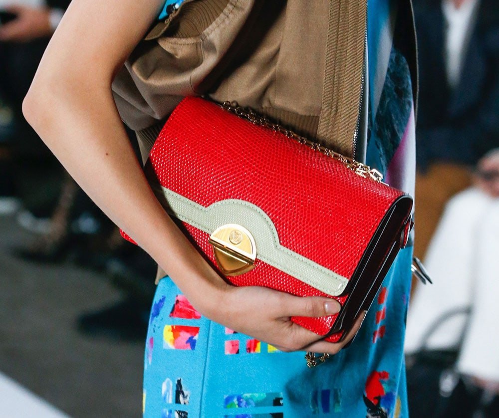 Reference image illustrating Louis Vuitton Spring 2019 Handbag Collection: Sculptural Shapes, Mini Suitcases, and Avant-Garde Design