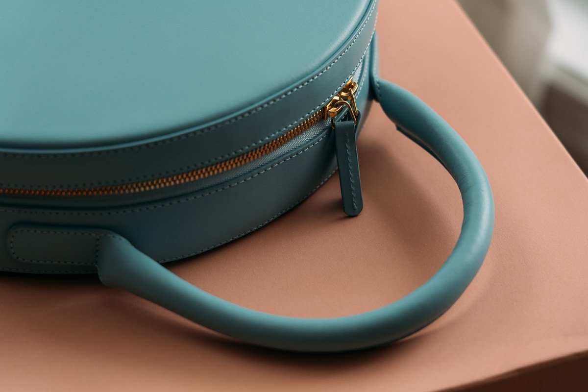 Reference image illustrating Mansur Gavriel Monogramming Service: Hand-Painted Personalization for Your Luxury Bag