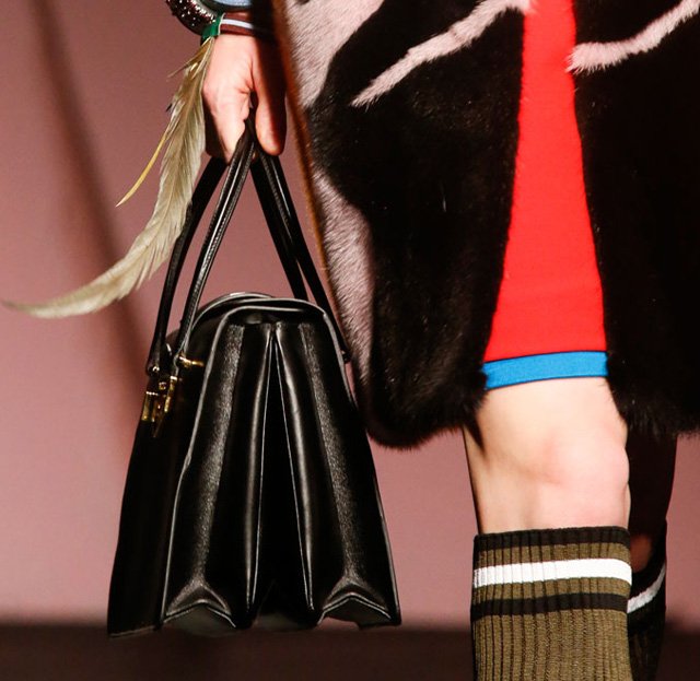Reference image illustrating Prada Spring 2014 Handbags: Artistic Portraits and Feminist Design