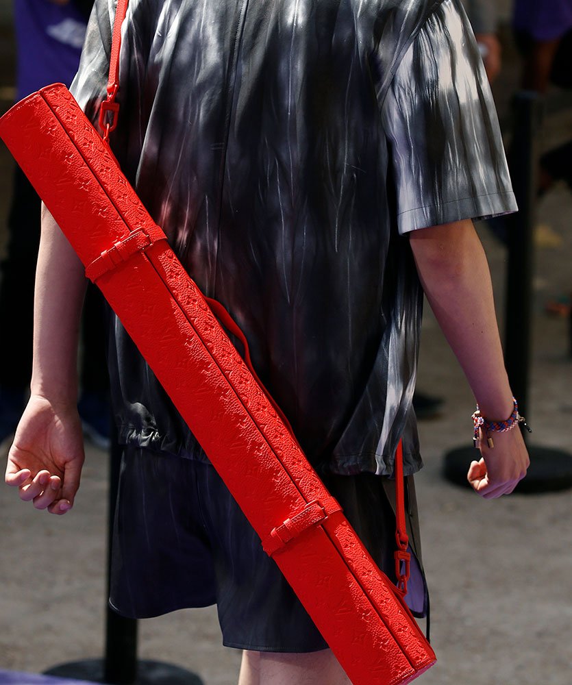 Reference image illustrating Virgil Abloh's First Louis Vuitton Collection: Transparent Keepalls, Grenade-Pin Details, and Neon Accents