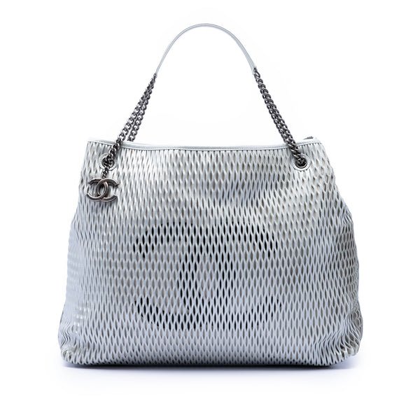 Reference image illustrating Chanel CC Logo Charm Tote Perforated Leather Medium: A Detailed Review